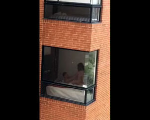 Hidden cam hook-up vid filmed thru dormitory balcony window
